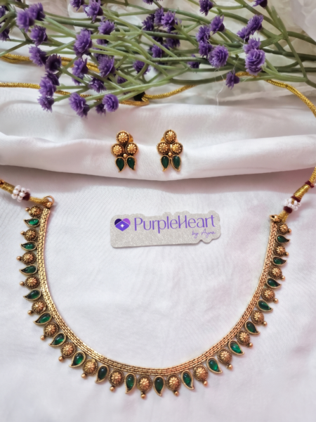 Golden mango floral neckpiece with green stone drops and matching earrings - Purple Heart by Ayra